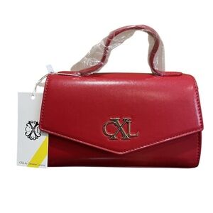CXL by Christian Lacroix Laine Matte Patent Crossbody Bag in red.